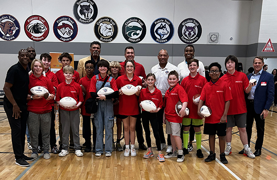 Image of Hall of Fame enshrinees with students and staff.