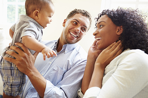 Image of young family smiling